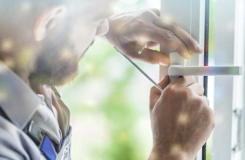 Window Lock Repair Locksmith working on window handle and lock