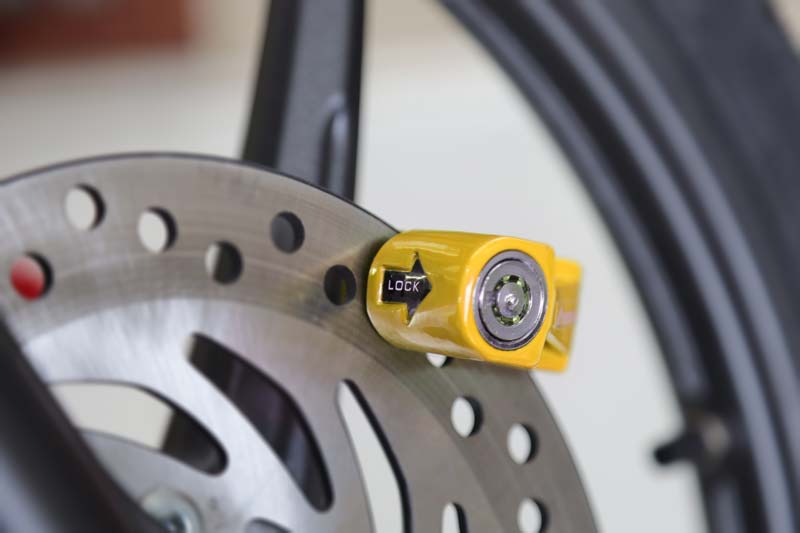 Yellow Bike disc lock on bike disc