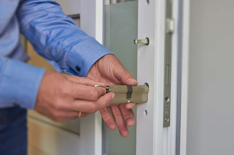 Locksmith installing a new euro cylinder